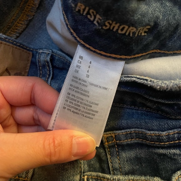 Hi-Rise Distressed Jean Shorts - Picture 5 of 9